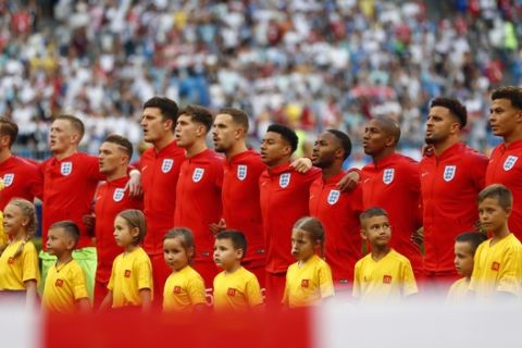 England national soccer team players stand prior to the start of the quarterfinal match between Sweden and England at the 2018 soccer World Cup in the Samara Arena, in Samara, Russia, Saturday, July 7, 2018. (AP Photo/Matthias Schrader )