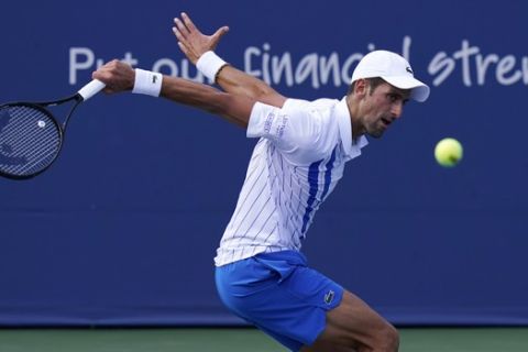 Novak Djokovic, of Serbia, hits a shot to Jan-Lennard Struff, of Germany, during the quarterfinals at the Western & Southern Open tennis tournament Wednesday, Aug. 26, 2020, in New York. (AP Photo/Frank Franklin II)