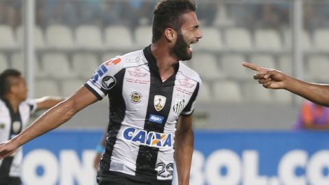 Thiago Maia, of Brazil's Santos, left, celebrates with teammate Jonathan Copete during a Copa Libertadores soccer match against Peru's Sporting Cristal in Lima, Peru, Thursday, March 9, 2017. (AP Photo/Martin Mejia)