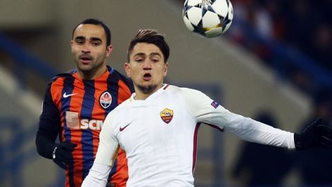 Roma's Cengiz Under, right, duels for the ball with Shakhtar's Ismaily during the Champions League, round of 16, first-leg soccer match between Shakhtar Donetsk and Roma at the Metalist Stadium in Kharkiv, Ukraine, Wednesday, Feb. 21, 2018. (AP Photo/Efrem Lukatsky)