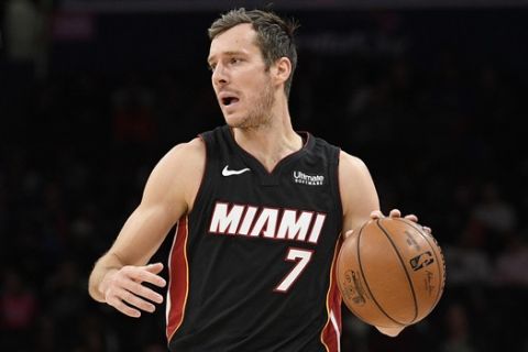 Miami Heat guard Goran Dragic (7) dribbles the ball during the first half of an NBA basketball game against the Washington Wizards, Sunday, March 8, 2020, in Washington. (AP Photo/Nick Wass)