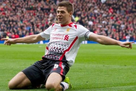 Liverpool's Steven Gerrard celebrates after scoring against Manchester United during their English Premier League soccer match at Old Trafford Stadium, Manchester, England, Sunday March 16, 2014. (AP Photo/Jon Super) Britain Soccer Premier League