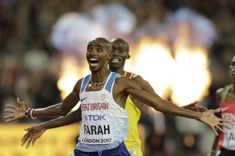 Britain's Mo Farah, left, celebrates after winning the Men's 10,000 meters final during the World Athletics Championships in London Friday, Aug. 4, 2017. (AP Photo/Tim Ireland) (AP Photo/Tim Ireland)