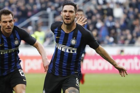Inter Milan's Matteo Politano, right, celebrates after scoring his side's opening goal during the Serie A soccer match between Inter Milan and Spal at the San Siro Stadium, in Milan, Italy, Sunday, March 10, 2019. (AP Photo/Antonio Calanni)