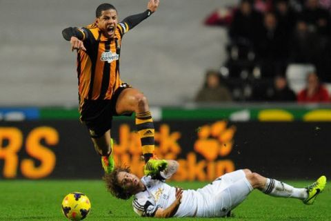 SWANSEA, WALES - DECEMBER 09:  Hull player Curtis Davies (l) is challenged by Swansea player Jose Canas during the Barclays Premier league match between Swansea City and Hull City at the Liberty Stadium on December 9, 2013 in Swansea, Wales.  (Photo by Stu Forster/Getty Images) ORG XMIT: 170625173