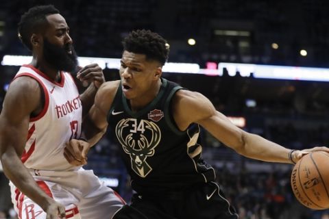 Milwaukee Bucks' Giannis Antetokounmpo tries to drive past Houston Rockets' James Harden during the second half of an NBA basketball game Wednesday, March 7, 2018, in Milwaukee. (AP Photo/Morry Gash)