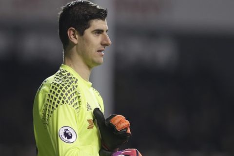 Chelsea goalkeeper Thibaut Courtois  pulls on his gloves during the English Premier League soccer match between Tottenham Hotspur and Chelsea at White Hart Lane stadium in London, Wednesday, Jan.  7,  2017. (AP Photo/Alastair Grant)