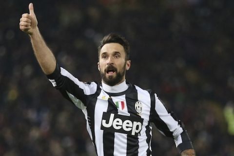 Juventus forward Mirko Vucinic, of Montenegro, celebrates after scoring during the Serie A soccer match between Bologna and Juventus at the Dall' Ara stadium in Bologna, Italy, Saturday, March 16, 2013. (AP Photo/Antonio Calanni)