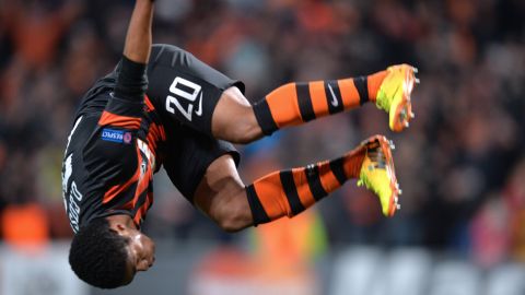 FC Shakhtar Donetsk's Douglas Costa celebrates after he scored against Real Sociedad during their UEFA Champions League Group A football match in Donetsk on November 27, 2013. AFP PHOTO/ SERGEI SUPINSKY        (Photo credit should read SERGEI SUPINSKY/AFP/Getty Images)