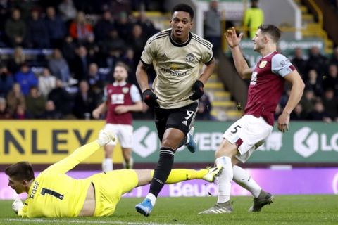 Manchester United's Anthony Martial, center, celebrates scoring against Burnley during the English Premier League soccer match at Turf Moor, Burnley, England, Saturday Dec. 28, 2019. (Martin Rickett/PA via AP)