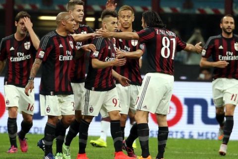 Ac Milan forward Stephan El Shaarawy (C) celebrates with teammates after scoring a goal during the Italian serie A soccer match between AC Milan and Fc Torino at Giuseppe Meazza stadium in Milan, 24 may 2015.  ANSA / MATTEO BAZZI