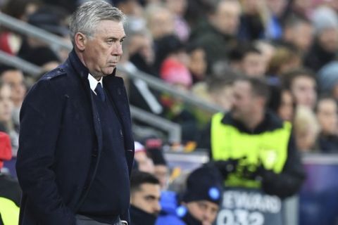 Napoli coach Carlo Ancelotti watches the Europa League round of 16 second leg soccer match between FC Salzburg and Napoli in the Arena stadium in Salzburg, Austria, Thursday, March 14, 2019.Napoli coach Carlo Ancelotti had to swallow his first loss in the Europa League after winning the previous three games, enough to advance. (AP Photo/Kerstin Joensson)