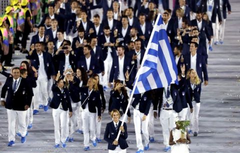 Sofia Bekatorou carries the flag of Greece during the opening ceremony for the 2016 Summer Olympics in Rio de Janeiro, Brazil, Friday, Aug. 5, 2016. (AP Photo/Matt Slocum)