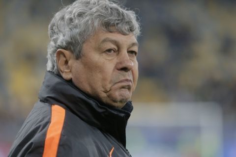 Shakhtar coach Mircea Lucescu stands prior to the start of the Champions League group A soccer match between Shakhtar Donetsk and Paris Saint Germain at the Arena Lviv stadium in Lviv, Western Ukraine, Wednesday, Sept. 30, 2015. (AP Photo/Efrem Lukatsky)