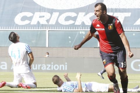 Genoa's Goran Pandev, right, celebrates after scoring his side's opening goal during a Serie A soccer match between Genoa and SPAL at the Luigi Ferraris Stadium in Genoa, Italy, Sunday, July 12, 2020. (Tano Pecoraro/LaPresse via AP)