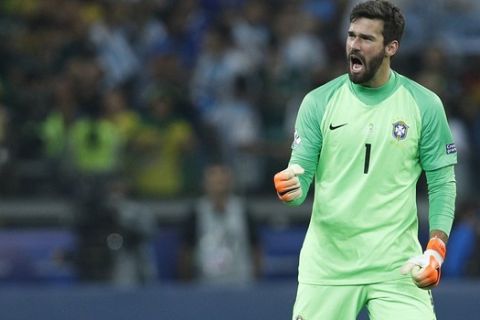 Brazil's goalkeeper Alisson celebrates his team's 2-0 victory over Argentina at the end of their Copa America semifinal soccer match at Mineirao stadium in Belo Horizonte, Brazil, Tuesday, July 2, 2019. (AP Photo/Victor R. Caivano)