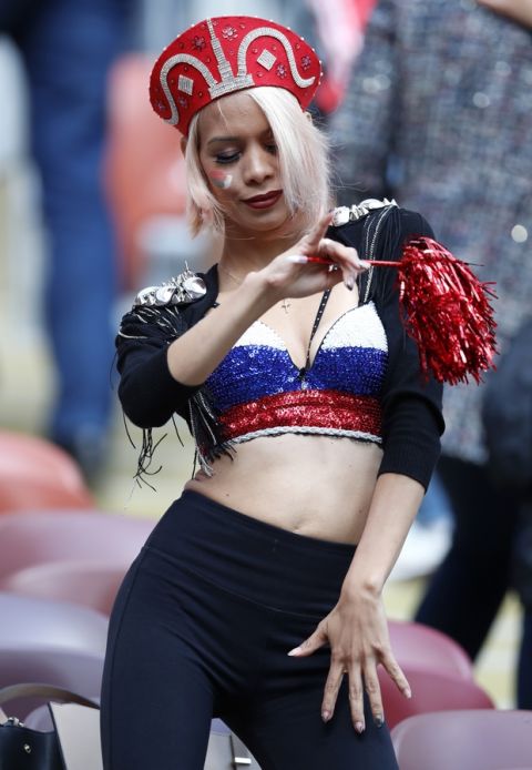 A Russian soccer fan dances ahead of the group A match between Russia and Saudi Arabia which opens the 2018 soccer World Cup at the Luzhniki stadium in Moscow, Russia, Thursday, June 14, 2018. (AP Photo/Hassan Ammar)