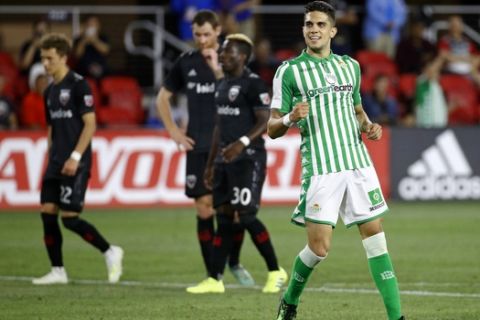 Real Betis' Marc Bartra, right, celebrates his goal in the second half of a friendly soccer match against D.C. United, Wednesday, May 22, 2019, in Washington. (AP Photo/Patrick Semansky)