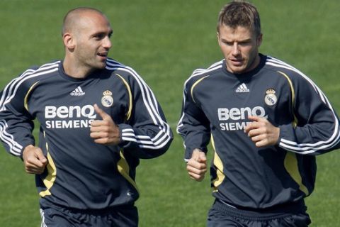 Real Madrid's British midfielder David Beckham, right, and his team mate Raul Bravo, from Spain, run during a training session in Valdebebas Stadium, on the outskirts of Madrid, Monday, April 16, 2007. (AP Photo/Emilio Naranjo)  ** LATIN AMERICA, CARIBBEAN AND SPAIN OUT **