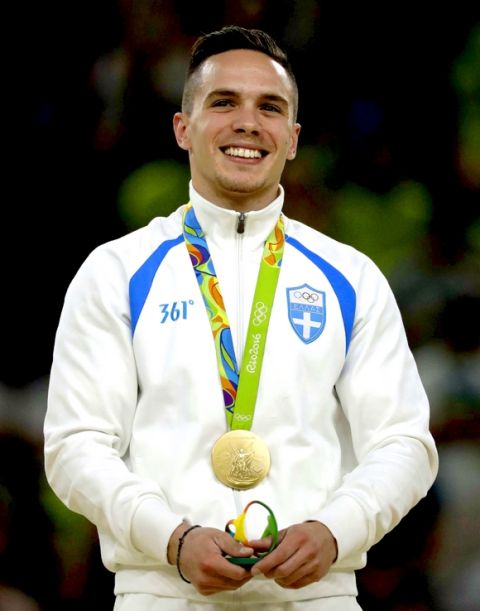 Greece's Eleftherios Petrounias, gold medallist, stands on the podium during the medal ceremony for the artistic gymnastics men's rings final at the 2016 Summer Olympics in Rio de Janeiro, Brazil, Monday, Aug. 15, 2016. (AP Photo/Julio Cortez)