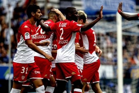 Monaco's team celebrate their first goal during the French League One soccer match between Strasbourg and Monaco in Strasbourg, eastern France in Strasbourg Eastern France (AP Photo/Jean-Francois Badias)