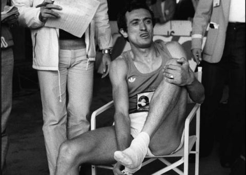 Pietro Mennea of Italy relaxes and removes his shoes Wednesday, Spet. 12, 1979 after he broke the world record in the 200-meters dash event at the World University Games in Mexico City.(AP photo/Drew)