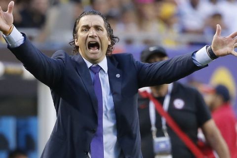 Chile coach Juan Antonio Pizzi speaks during a Copa America Centenario semifinal soccer match between Chile and Colombia at Soldier Field in Chicago, Wednesday, June 22, 2016. (AP Photo/Charles Rex Arbogast)