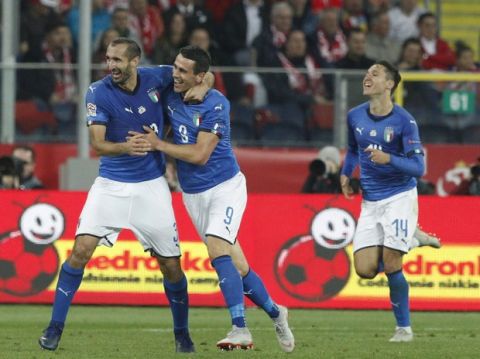 From left, Italy's Giorgio Chiellini, Kevin Lasagna Federico Chiesa celebrate after their teammate Cristiano Biraghi scored during the UEFA Nations League soccer match between Poland and Italy at the Silesian Stadium Chorzow, Poland, Sunday Oct. 14, 2018. Italy won 1.0. (AP Photo/Czarek Sokolowski)