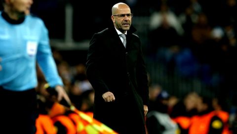 Dortmund coach Peter Bosz reacts during the Champions League Group H soccer match between Real Madrid and Borussia Dortmund at the Santiago Bernabeu stadium in Madrid, Spain, Wednesday, Dec. 6, 2017. (AP Photo/Paul White)