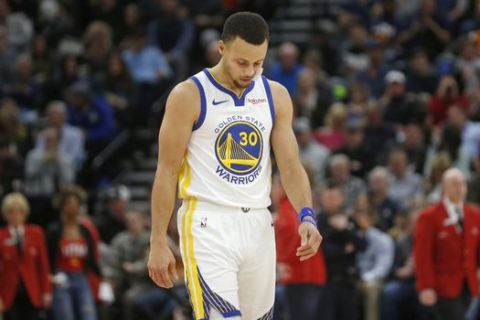 Golden State Warriors guard Stephen Curry (30) walks to the bench at a timeout in the second half of an NBA basketball game against the Utah Jazz, Wednesday Dec. 19, 2018, in Salt Lake City. The Jazz won 108-103. (AP Photo/Rick Bowmer)