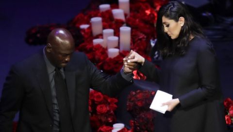Vanessa Bryant is helped off the stage by former NBA player Michael Jordan after speaking during a celebration of life for her husband Kobe Bryant and daughter Gianna Monday, Feb. 24, 2020, in Los Angeles. (AP Photo/Marcio Jose Sanchez)