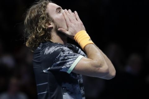 Stefanos Tsitsipas of Greece reacts after defeating Austria's Dominic Thiem to win their ATP World Finals singles final tennis match at the O2 arena in London, Sunday, Nov. 17, 2019. (AP Photo/Kirsty Wigglesworth)