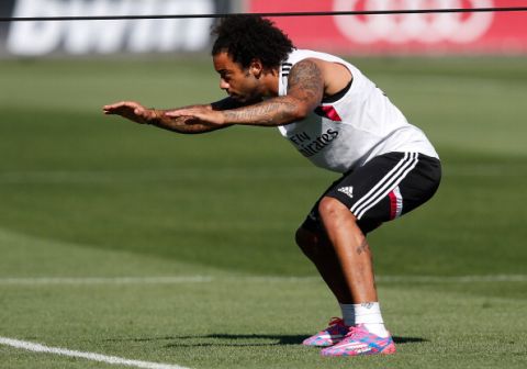 MADRID, SPAIN - AUGUST 07: Marcelo Vieira of Real Madrid exercises during a training session at Valdebebas training ground on August 7, 2014 in Madrid, Spain.  (Photo by Antonio Villalba/Real Madrid via Getty Images)
