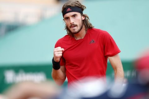 Stefanos Tsitsipas of Greece celebrates winning a point agains Andrey Rublev of Russia during the Monte Carlo Tennis Masters tournament finals in Monaco, Sunday, April 18, 2021. (AP Photo/Jean-Francois Badias)