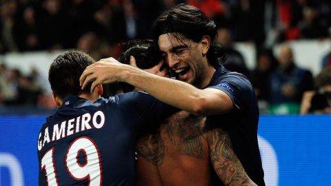 PARIS, FRANCE - MARCH 06:  Ezequiel Lavezzi of PSG takes off his shirt and celebrates with team mates after he scores his team first goal during the Round of 16 UEFA Champions League match between Paris St Germain and Valencia CF at Parc des Princes on March 6, 2013 in Paris, France.  (Photo by Dean Mouhtaropoulos/Getty Images)