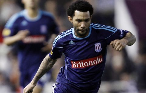 Stoke City's Jermaine Pennant drives the ball during the second leg of their Europa League round of 32  soccer match against Valencia at the Mestalla stadium in Valencia, Spain, Thursday, Feb. 23, 2012. (AP Photo/Alberto Saiz)