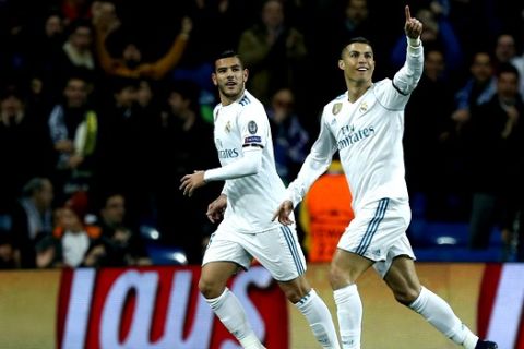 Real Madrid's Cristiano Ronaldo, right, celebrates with team mate Real Madrid's Theo Hernandez after scoring his side's second goal during the Champions League Group H soccer match between Real Madrid and Borussia Dortmund at the Santiago Bernabeu stadium in Madrid, Spain, Wednesday, Dec. 6, 2017. (AP Photo/Francisco Seco)