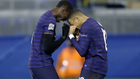 France's Kylian Mbappe, right, celebrates with France's Paul Pogba after scoring his side's second goal during the UEFA Nations League soccer match between Croatia and France at Maksimir Stadium in Zagreb, Croatia, Wednesday, Oct. 14, 2020. (AP Photo/Darko Bandic)