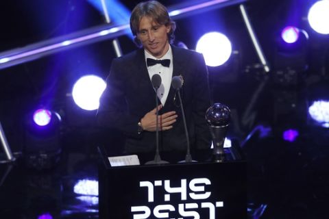 Croatia's soccer star Luka Modric receives the Best FIFA Men's Player award during the ceremony of the Best FIFA Football Awards in the Royal Festival Hall in London, Britain, Monday, Sept. 24, 2018. (AP Photo/Frank Augstein)