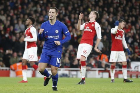 Chelsea's Eden Hazard celebrates scoring his side's first goal during the English Premier League soccer match between Arsenal and Chelsea at Emirates stadium in London, Wednesday, Jan. 3, 2018. (AP Photo/Frank Augstein)