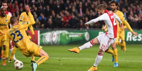Ajax Amsterdam's Danish midfielder Lasse Schone scores his second goal during the UEFA Champions League football match between Ajax Amsterdam and APOEL Nicosia in Amsterdam, on December 10, 2014. AFP PHOTO/Emmanuel Dunand         (Photo credit should read EMMANUEL DUNAND/AFP/Getty Images)