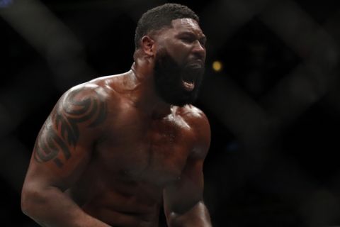 Curtis Blaydes celebrates his win over Alistair Overeem during their heavyweight UFC 225 Mixed Martial Arts bout Saturday, June 9, 2018, in Chicago. (AP Photo/Jim Young)