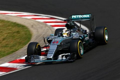 BUDAPEST, HUNGARY - JULY 25:  Lewis Hamilton of Great Britain and Mercedes GP drives during qualifying for the Formula One Grand Prix of Hungary at Hungaroring on July 25, 2015 in Budapest, Hungary.  (Photo by Clive Mason/Getty Images)