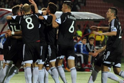 Albania's players celebrate after scoring a goal during the Euro 2016 group I qualifying football match between Armenia and Albania on October 11, 2015 at the Replubican stadium in Yerevan. AFP PHOTO / KAREN MINASYAN        (Photo credit should read KAREN MINASYAN/AFP/Getty Images)