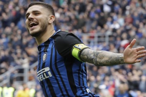 Inter Milan's Mauro Icardi celebrates after scoring the opening goal during a Serie A soccer match between Inter Milan and Hellas Verona, at the San Siro stadium in Milan, Italy, Saturday, March 31, 2018. (AP Photo/Luca Bruno)