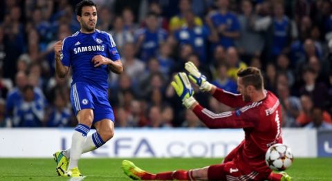LONDON, ENGLAND - SEPTEMBER 17:  Cesc Fabregas of Chelsea scores the opening goal past Ralf Faehrmann of Schalke during the UEFA Champions League Group G match between Chelsea and FC Schalke 04 on September 17, 2014 in London, United Kingdom.  (Photo by Mike Hewitt/Getty Images)