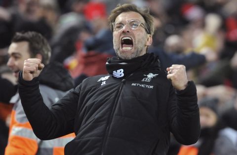 Liverpool manager Juergen Klopp celebrates after their second goal during the English Premier League soccer match between Liverpool and Tottenham Hotspur at Anfield in Liverpool, England, Sunday, Feb. 4, 2018. (AP Photo/Rui Vieira)