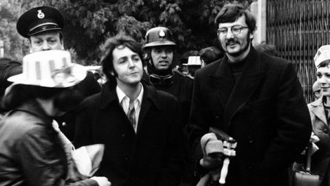 Beatle Paul McCartney is escorted by friends through the crowds outside Wembley Stadium, London, on May 18, 1968, to one of the turnstiles to take his place in the stadium to watch the Football Association Cup Final between Everton and West Bromwich Albion. (AP Photo)