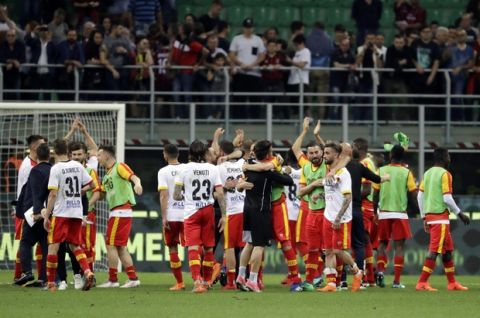 Benevento players celebrate their 1-0 victory at the end of a Serie A soccer match between AC Milan and Benevento, at the San Siro stadium in Milan, Italy, Saturday, April 21, 2018. (AP Photo/Luca Bruno)
