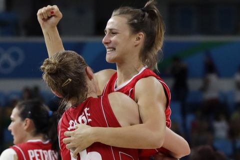 Serbia's Danielle Page (15) holds teammate Serbia's Nevena Jovanovic as they celebrate their women's bronze medal basketball game win over France at the 2016 Summer Olympics in Rio de Janeiro, Brazil, Saturday, Aug. 20, 2016. (AP Photo/Eric Gay)